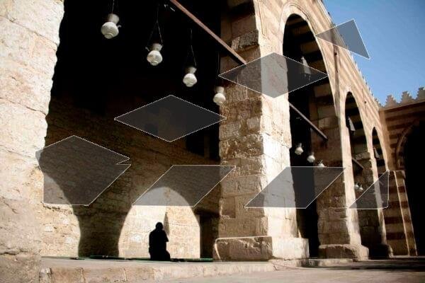 A man praying inside the Blue Mosque in Old Cairo