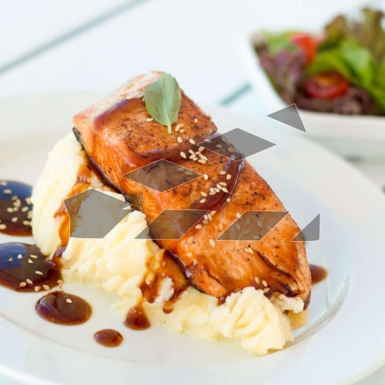 A plate featuring a fresh slice of salmon