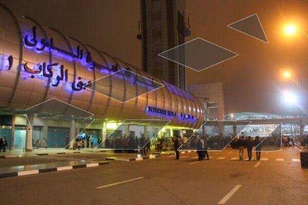A nighttime view of Cairo International Airport during the winter.