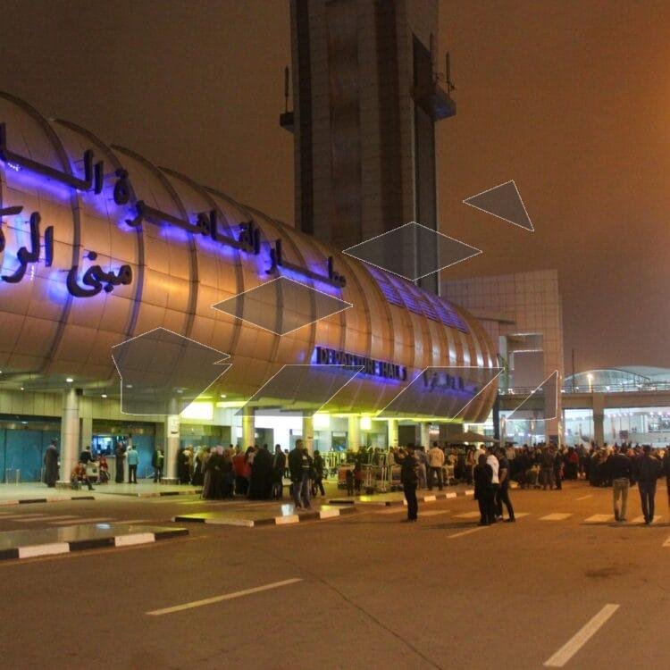 A nighttime view of Cairo International Airport during the winter.