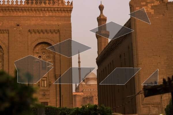 A breathtaking view featuring the Sultan Hassan Mosque and Al-Rifai Mosque, with the iconic dome of the Citadel of Saladin visible in between.