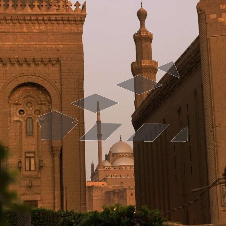 A breathtaking view featuring the Sultan Hassan Mosque and Al-Rifai Mosque, with the iconic dome of the Citadel of Saladin visible in between.