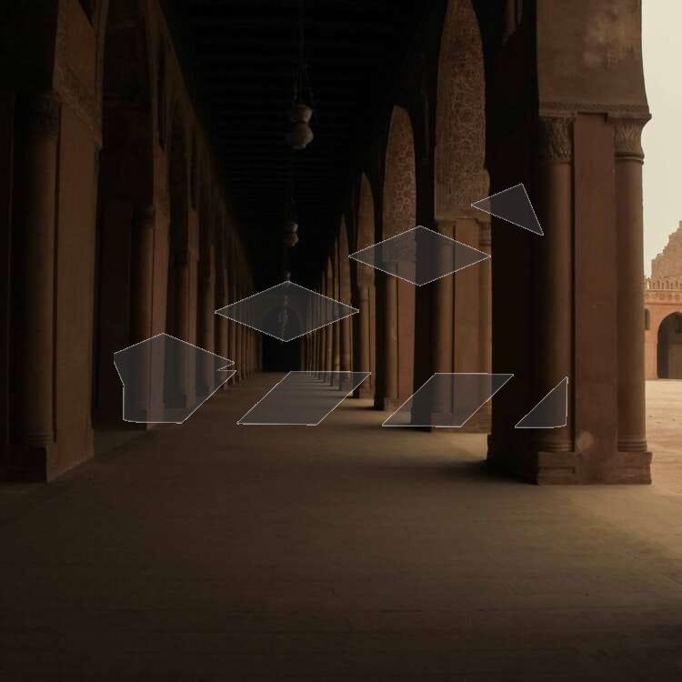An impressive view of the interior of Ahmed Ibn Tulun Mosque in Cairo, Egypt. The mosque's simple yet elegant design, with its tall columns, arched windows, and large central courtyard, highlights the beauty of early Islamic architecture. The intricate details and historic atmosphere make it a remarkable example of Egypt's architectural heritage