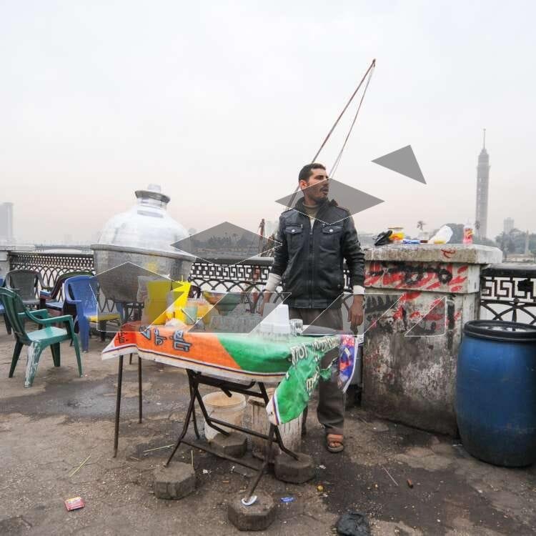 A street vendor prepares and serves Hummus El-Sham Egypt, Cairo.