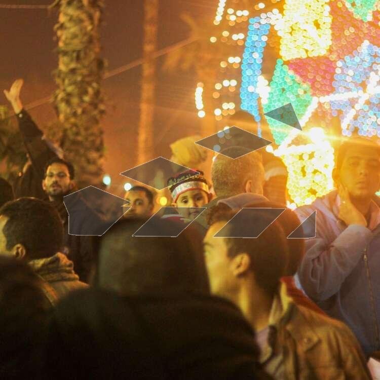 Women Carrying Children on Their Shoulders During Festive Mawlid Celebration – Cairo, Egypt