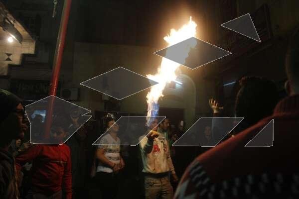 Young Men Performing Fire and Aerosol Spray Dance at Al-Hussein Mawlid – Cairo, Egypt