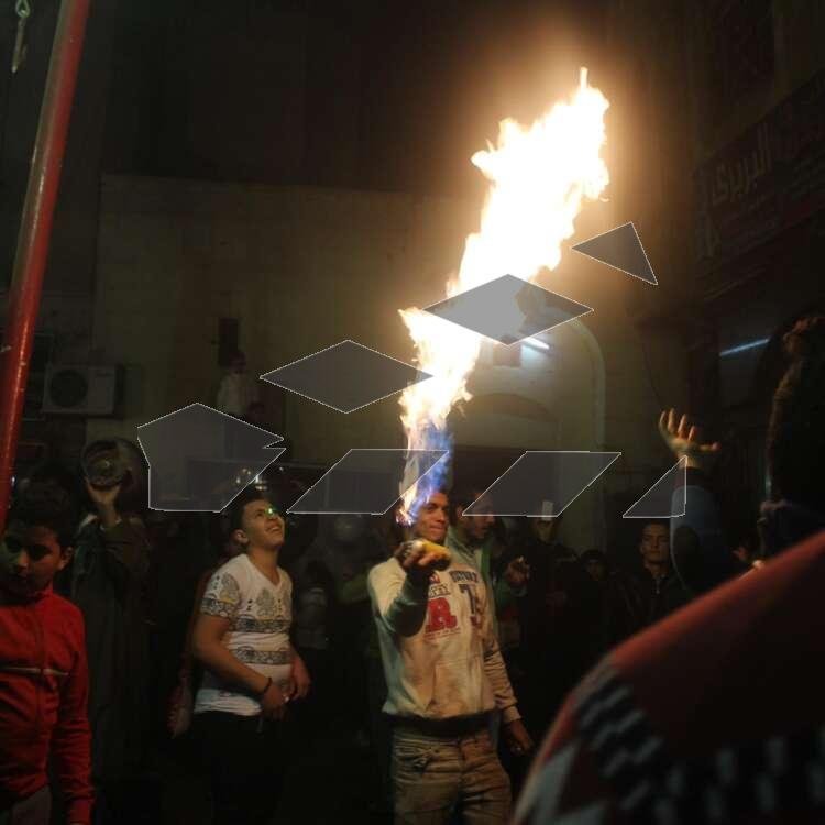 Young Men Performing Fire and Aerosol Spray Dance at Al-Hussein Mawlid – Cairo, Egypt
