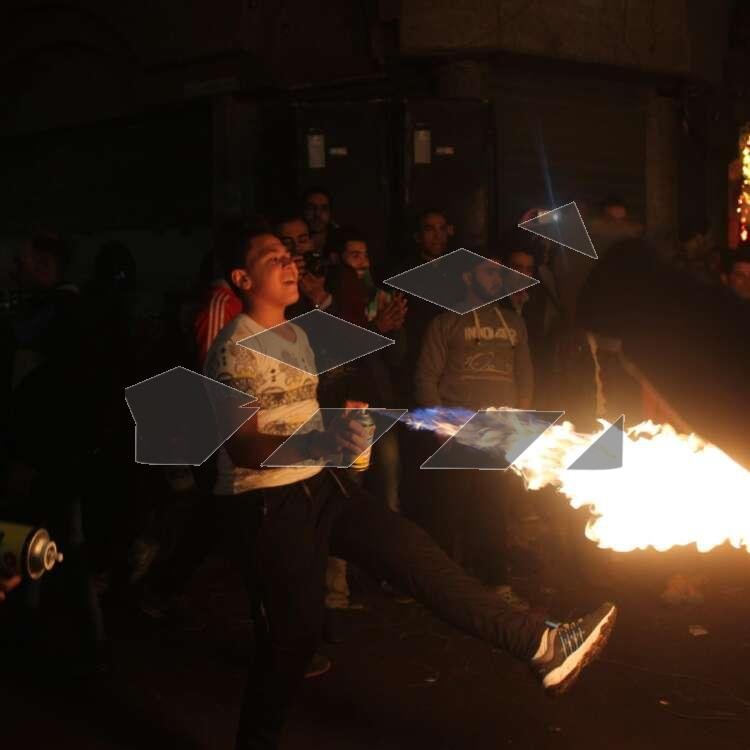 Young Men Performing Fire and Aerosol Spray Dance at Al-Hussein Mawlid – Cairo, Egypt