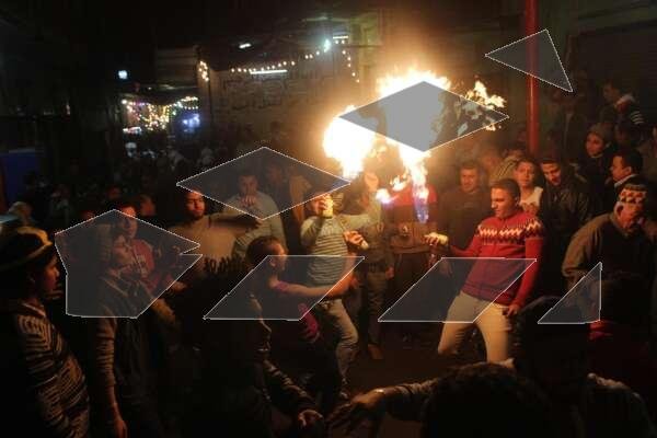 Young Men Performing Fire and Aerosol Spray Dance at Al-Hussein Mawlid – Cairo, Egypt