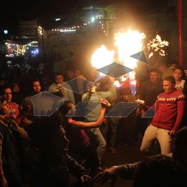 Young Men Performing Fire and Aerosol Spray Dance at Al-Hussein Mawlid – Cairo, Egypt