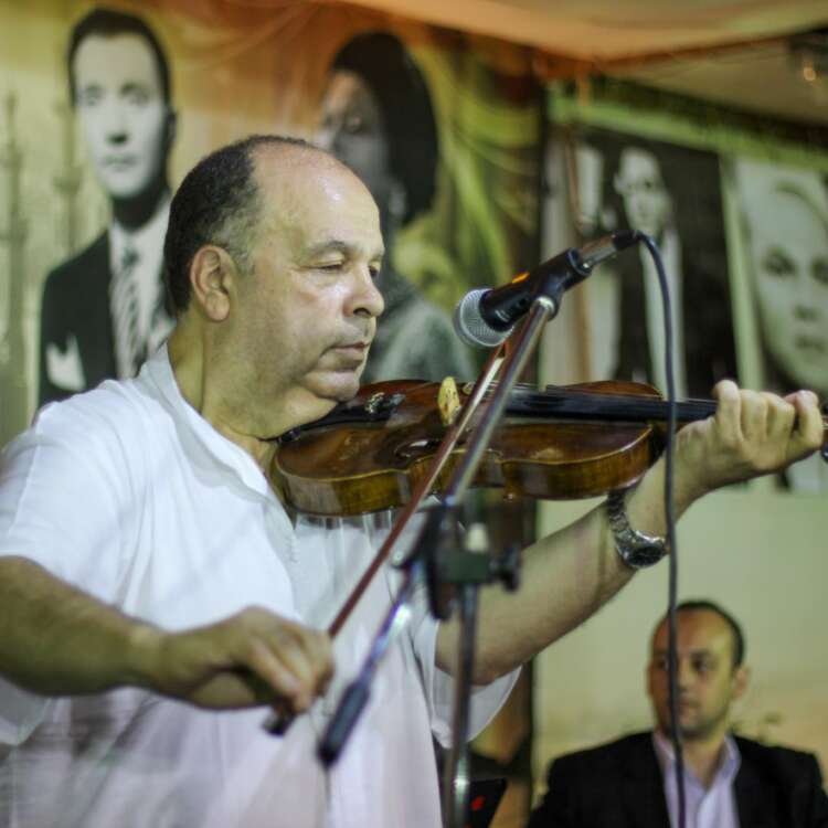 Oriental Violin Player – Expressive Musical Moment