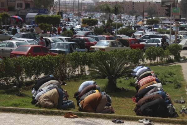 Friday Prayer at the Car Market in Nasr City – A Spiritual Scene Amidst Urban Hustle