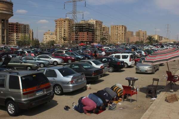 Friday Prayer at the Car Market in Nasr City – A Spiritual Scene Amidst Urban Hustle