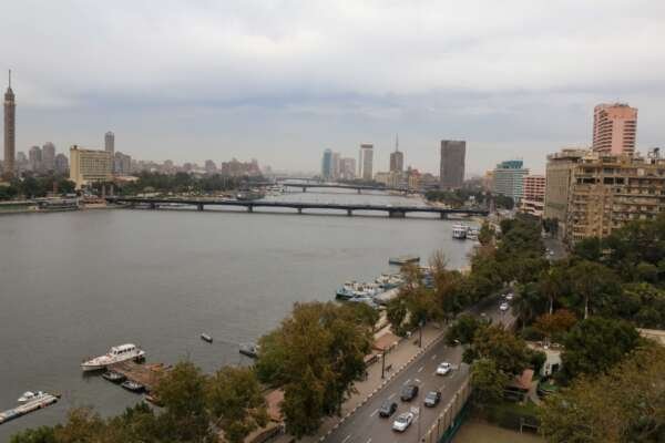 Nile River with Cairo Tower and Riverside Buildings on a Cloudy Day Nile River with Cairo Tower and Riverside Buildings on a Cloudy Day