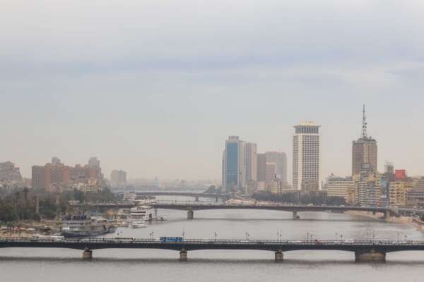 Nile River with Cairo Tower and Riverside Buildings on a Cloudy Day Nile River with Cairo Tower and Riverside Buildings on a Cloudy Day