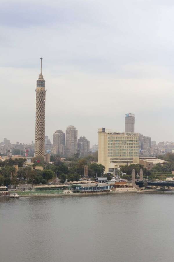Nile River with Cairo Tower and Riverside Buildings on a Cloudy Day Nile River with Cairo Tower and Riverside Buildings on a Cloudy Day