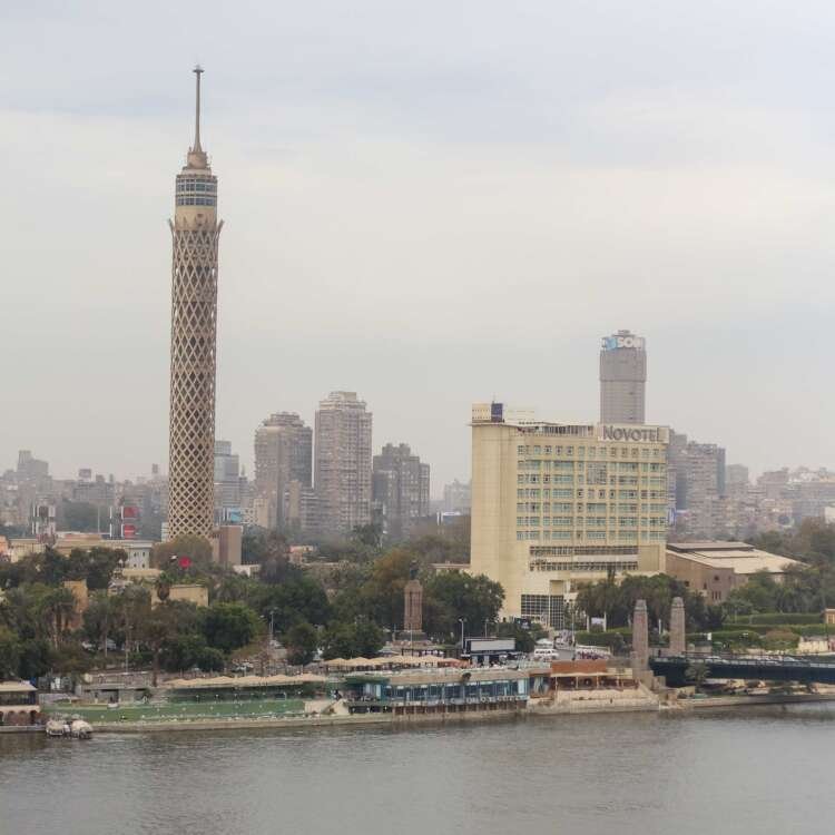 Nile River with Cairo Tower and Riverside Buildings on a Cloudy Day