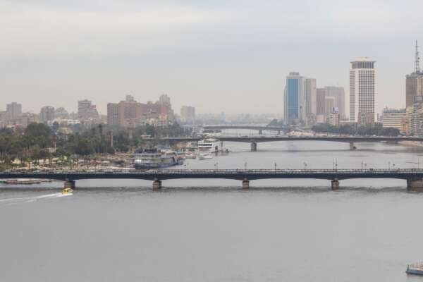 Nile River with Cairo Tower and Riverside Buildings on a Cloudy Day Nile River with Cairo Tower and Riverside Buildings on a Cloudy Day