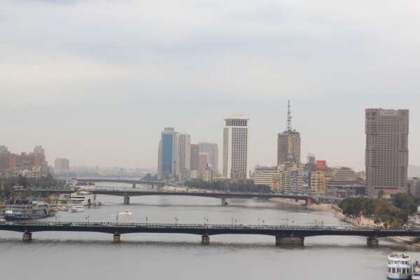 Nile River with Cairo Tower and Riverside Buildings on a Cloudy Day Nile River with Cairo Tower and Riverside Buildings on a Cloudy Day