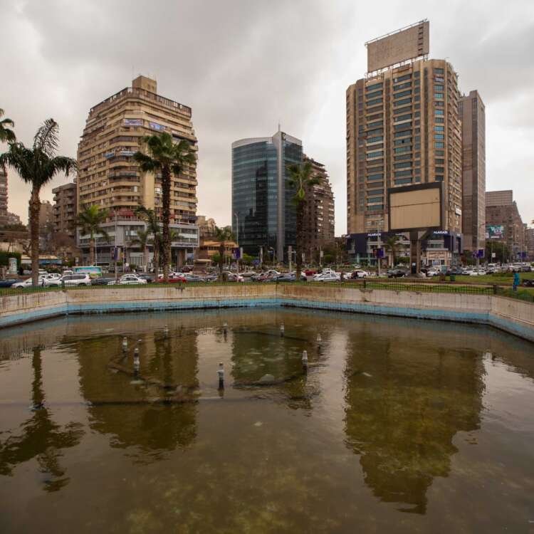 Urban Pond Surrounded by Tall Buildings in Cairo
