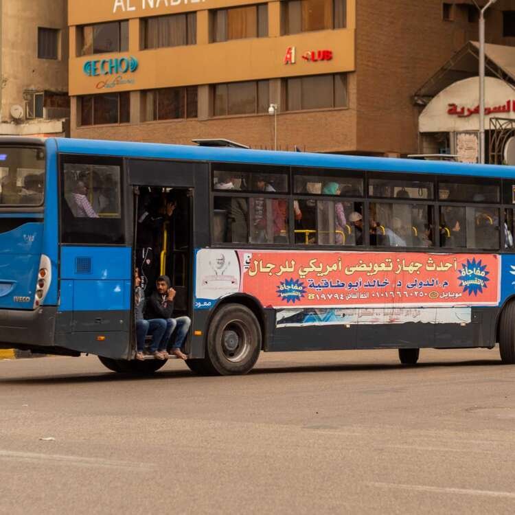 Blue City Bus with Arabic Advertisement in Cairo