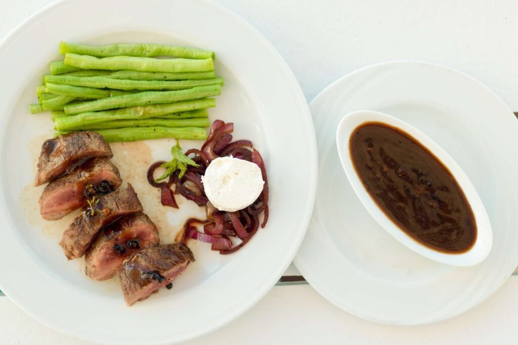 A plate featuring a fresh slice of beef