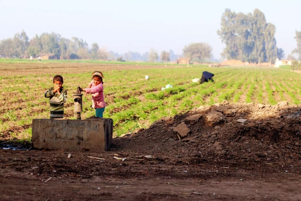Children at a Village Water Pump in Rural Egypt