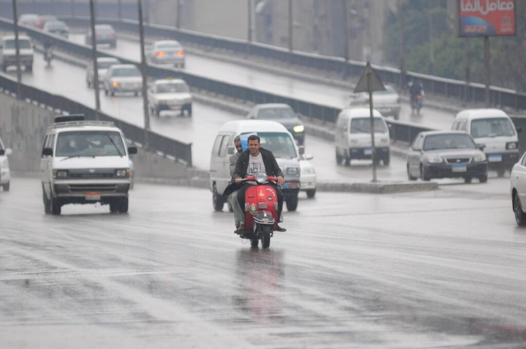 Rainy Cairo Scooter Commute