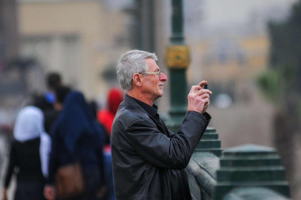 A man stands on Qasr El Nil Bridge in Cairo.