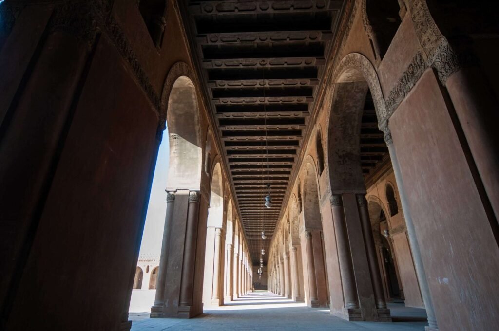 Interior view showcasing the architectural beauty of Ahmad Ibn Tulun Mosque in Old Cairo, Egypt
