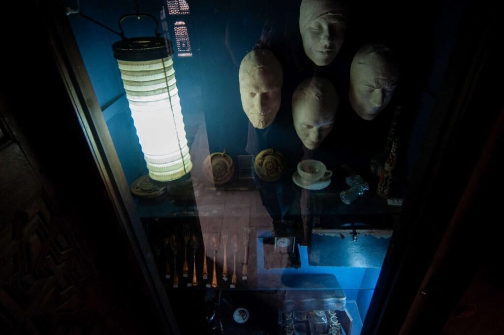 Close-up of a glass display case inside the Gayer-Anderson Museum in Old Cairo, Egypt.
