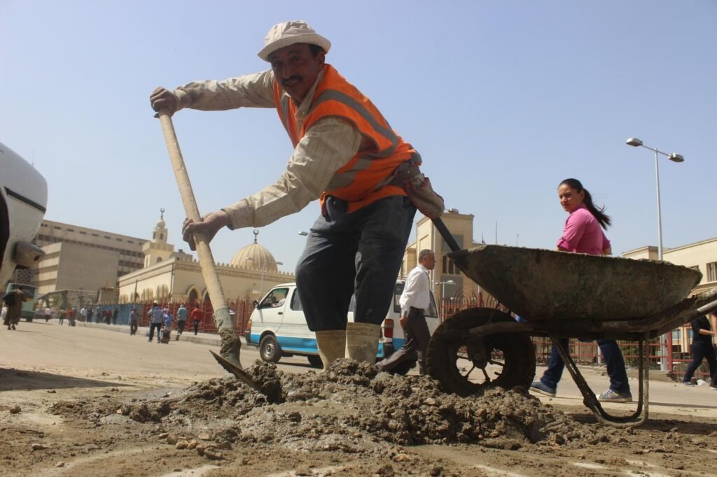 Cairo Street Worker with Shovel and Cart Daylight Scene