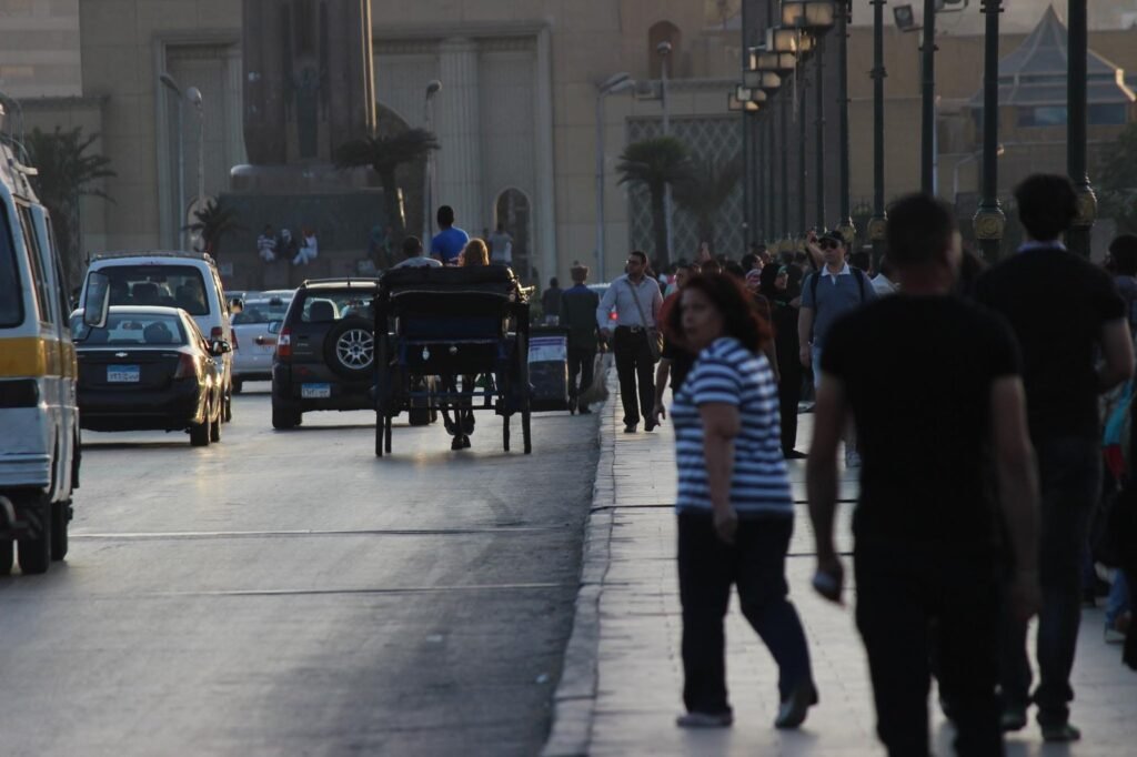 Qasr ElNil Corniche Cairo Pedestrians and Horse Carriage Street Scene