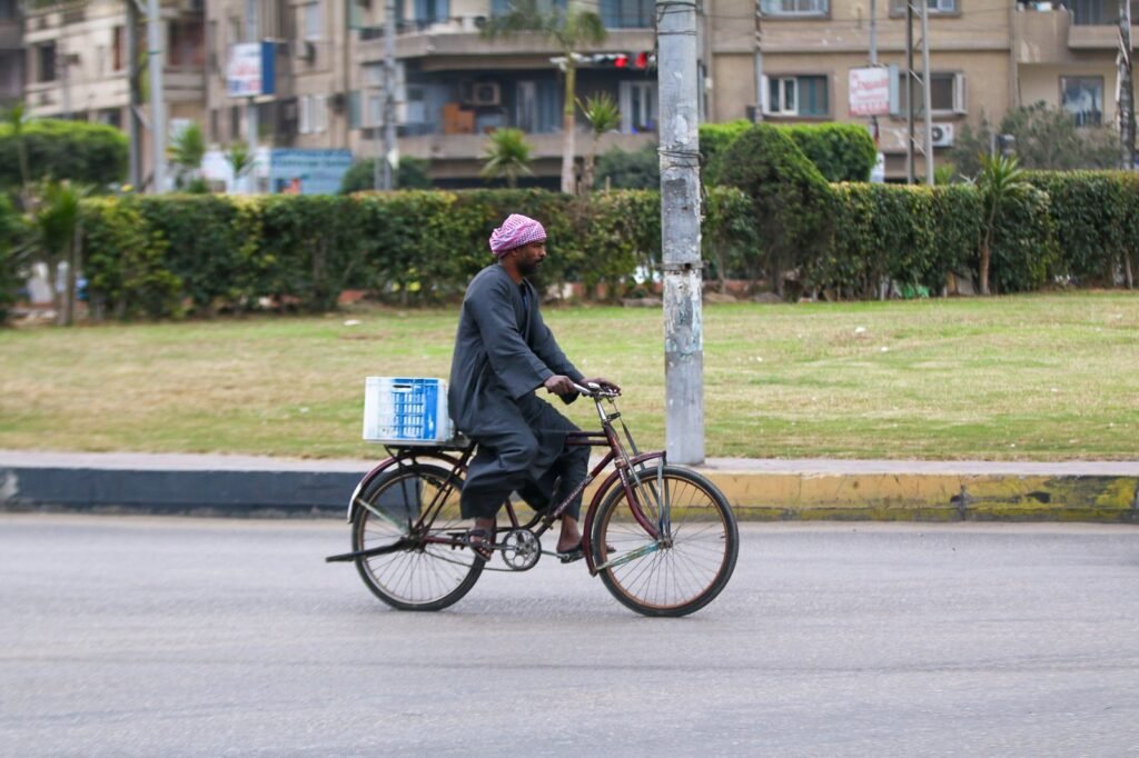 Man riding a bicycle in Cairo, Winter 2017