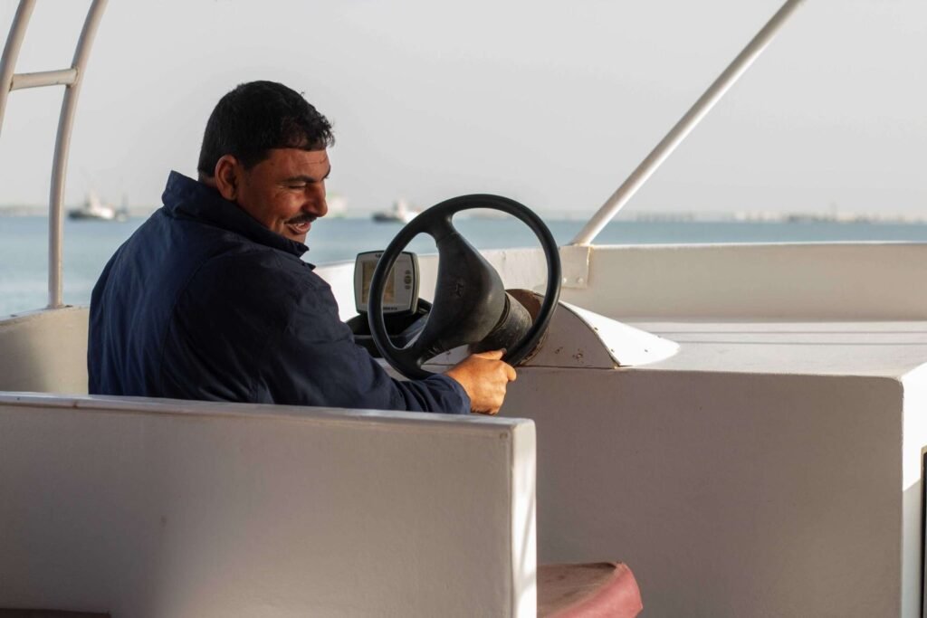 Smiling Boatman on Calm Waters – Egypt