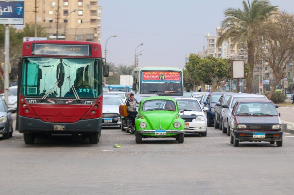 Green Volkswagen Beetle in Cairo Traffic