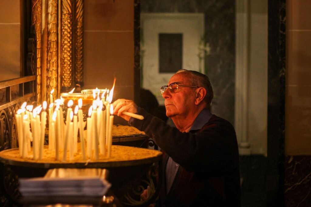 Lighting a Candle in a Coptic Church in Egypt