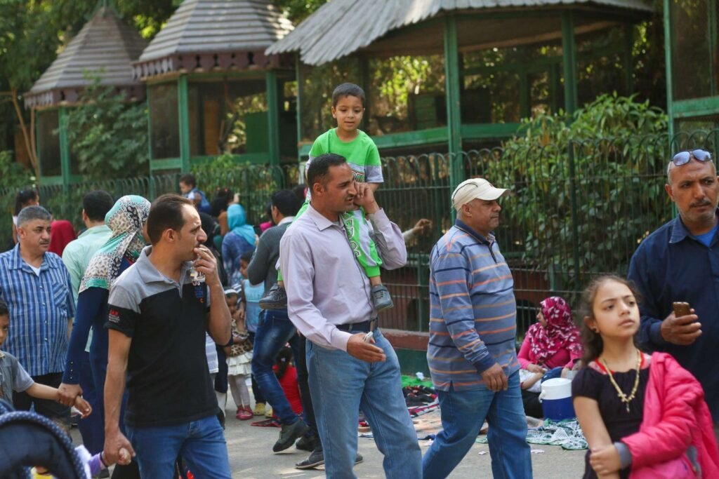 Father Carrying His Daughter at Giza Zoo During Eid al-Fitr, 2017