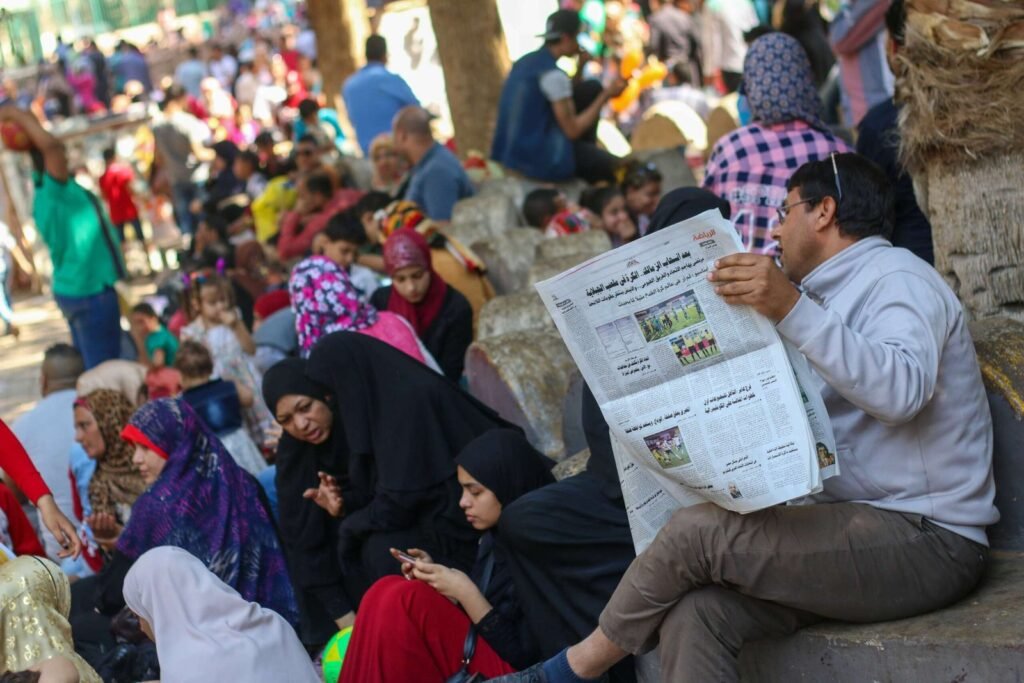 Man Reading a Newspaper at Giza Zoo During Eid al-Fitr 2017