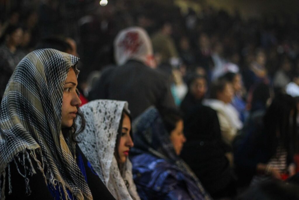 A Young Woman in Prayer on a Feast Day in Church