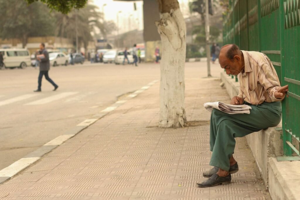Man Reading a Newspaper in a Street in Cairo, Egypt 2