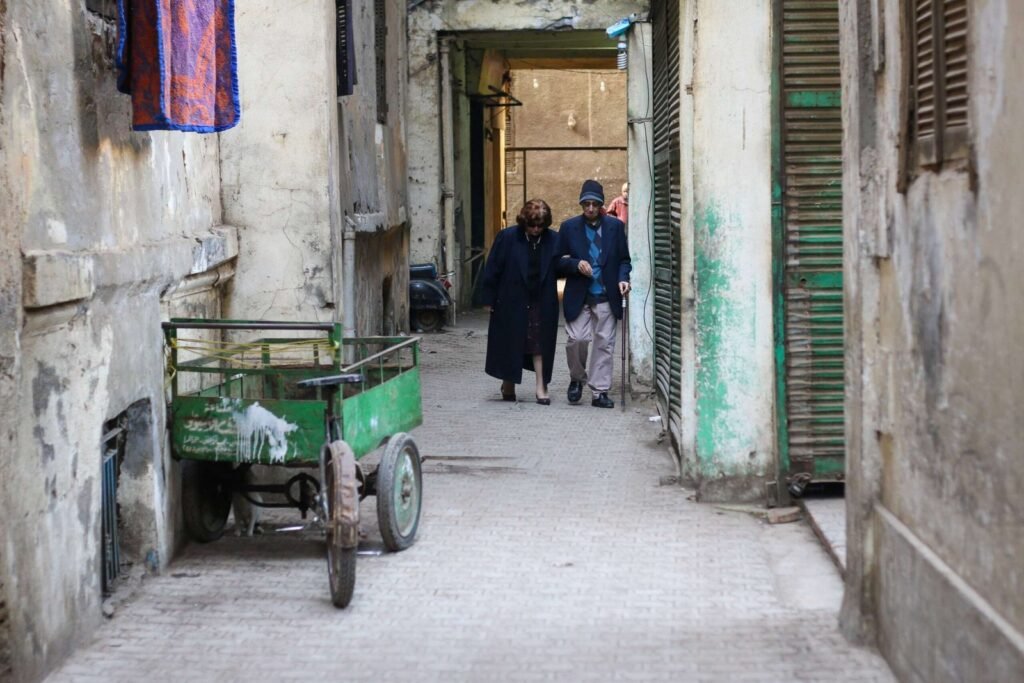 Elderly Couple Walking in a Narrow Alley – Cairo Winter 2017