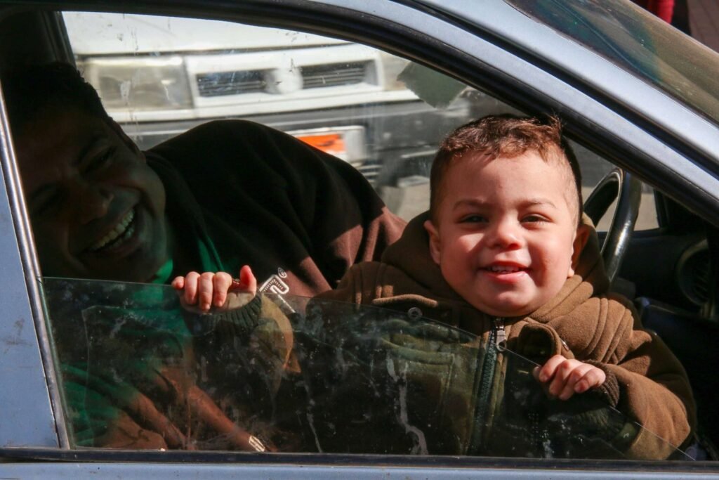Smiling Child at Car Window – Cairo Winter 2017