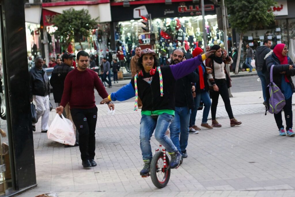 Street Performer Riding a Unicycle on Talaat Harb Street Downtown Cairo (Wust el Balad) (Wust el Balad)