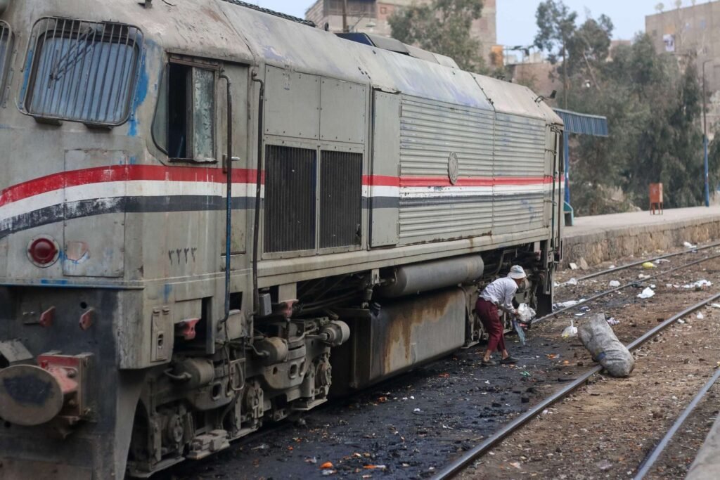 Railway Worker Cleaning the Platform at Cairo Train Station