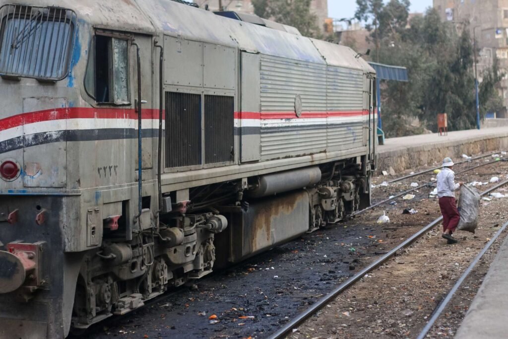 Railway Worker Cleaning the Platform at Cairo Train Station