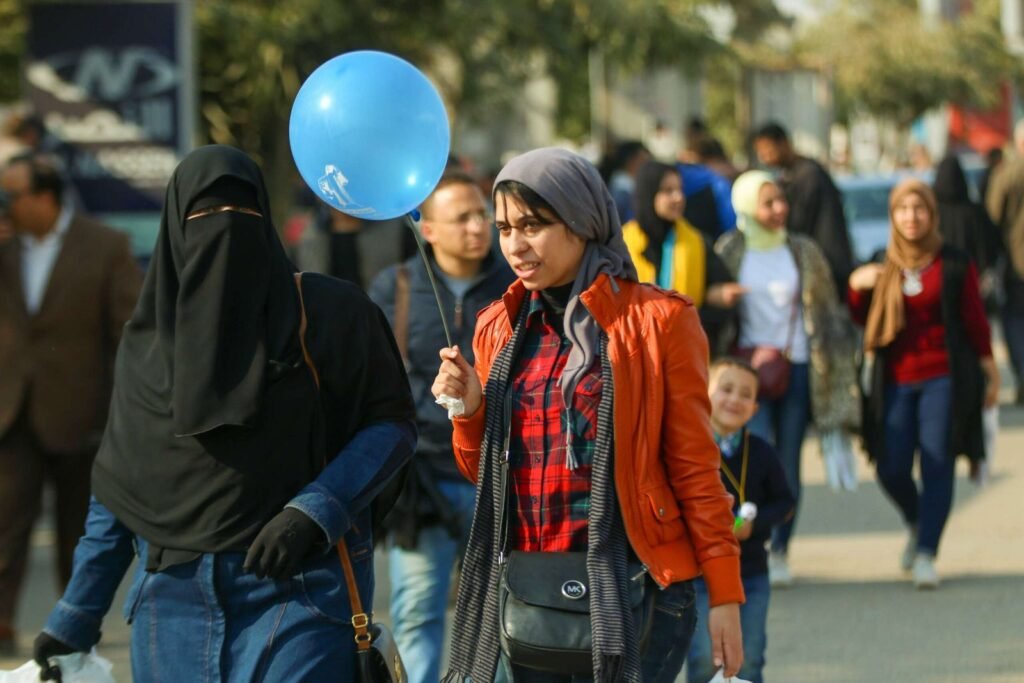 Women Walking with Blue Balloon at Cairo International Book Fair 2017