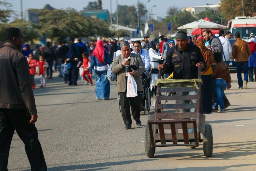 Man Pushing Metal Cart at Cairo International Book Fair – 2017