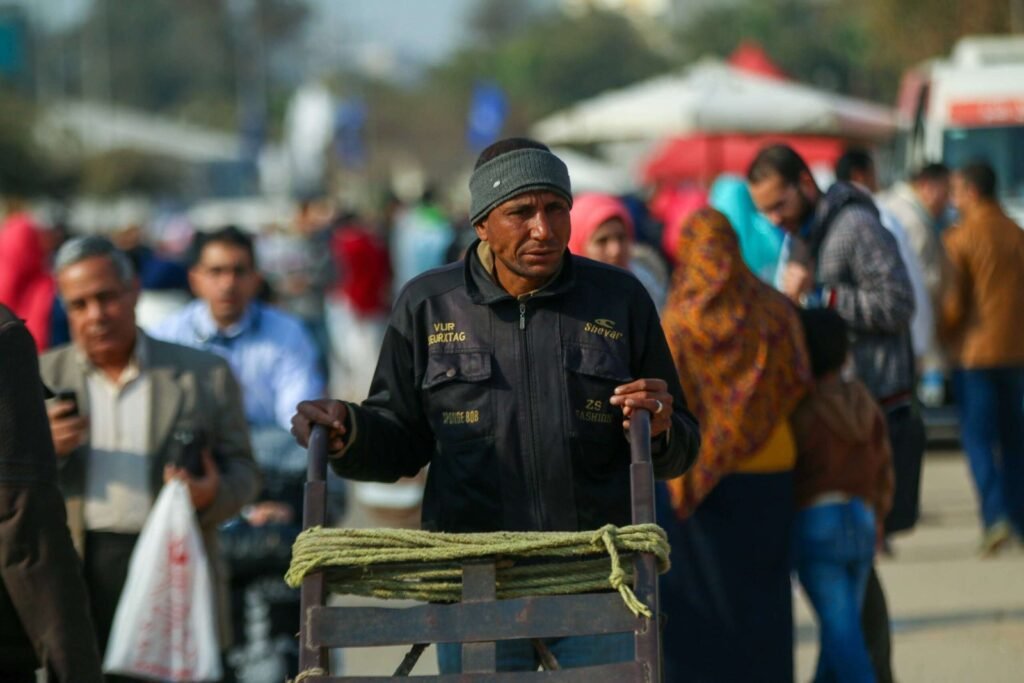 Man Pushing Metal Cart at Cairo International Book Fair – 2017 2