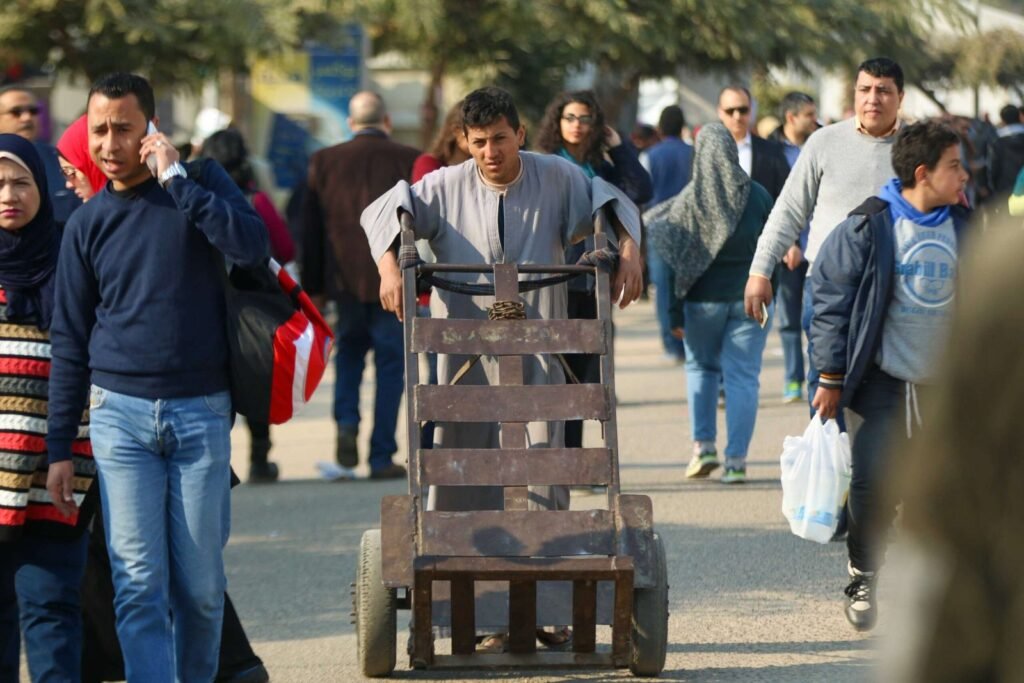 Man Pushing Metal Cart at Cairo International Book Fair – 2017 4